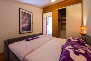 Postel nebo postele na pokoji v ubytování Apartment in Crikvenica 5600