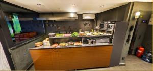 a kitchen with a counter with food on it at Elibol Hotel Old City in Istanbul