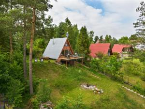 an aerial view of a cabin in the woods at Kaszuby Lake View in Żuromino