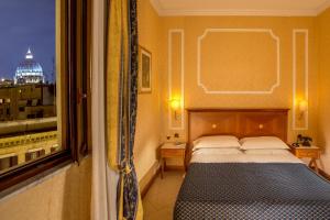 Llit o llits en una habitació de Vatican Amorim