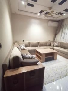 a living room with a couch and a coffee table at ميرمار in Tétouan