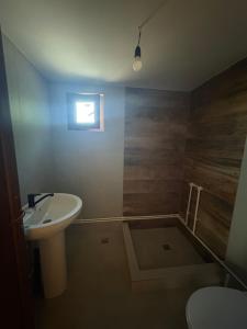 a bathroom with a sink and a toilet at Camping mery in Murighiol +8 photos