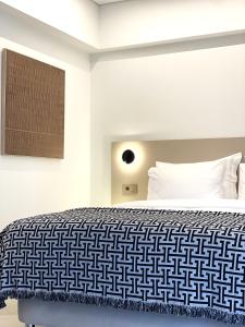 Postel nebo postele na pokoji v ubytování THE NIXON Luxury Suites and Apartment Hotel