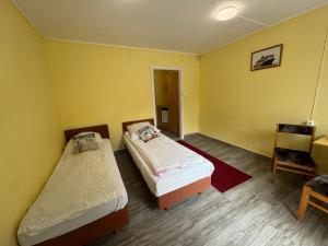 Łóżko lub łóżka w pokoju w obiekcie Pokoje Gościnne Standard