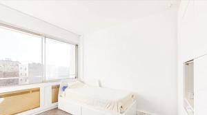 เตียงในห้องที่ Studio Ideal +2 ภาพ