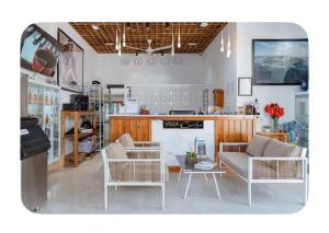 a living room with two couches and a table at Villa caribe phu quoc in Phu Quoc