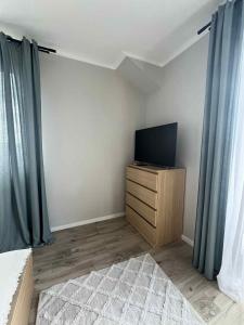 TV a/nebo společenská místnost v ubytování Morska Ostoja Chłapowo