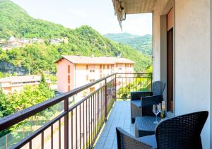 a balcony with chairs and a view of mountains at Chill & View BGY 20 min 