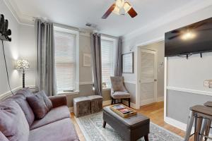 a living room with a couch and a chair at Polk 401 in Nashville