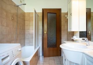 a bathroom with a sink and a toilet and a door at Chill & View BGY 20 min  +14 photos