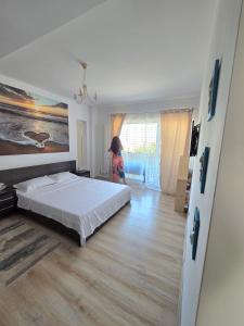 Postel nebo postele na pokoji v ubytování Amira Apartament