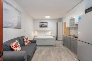 Kuchyň nebo kuchyňský kout v ubytování Apartment UGA