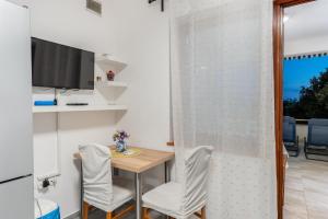 TV a/nebo společenská místnost v ubytování Apartment UGA