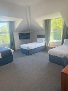 Postel nebo postele na pokoji v ubytování Chase Hotel