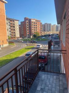 a balcony with a view of a street and buildings at RESIDENCE Erminia in Novara
