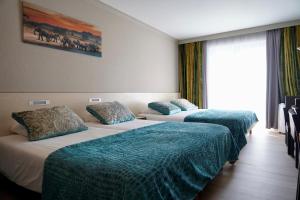Voodi või voodid majutusasutuse Hotel Prins Boudewijn toas