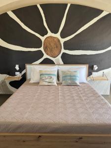 Letto o letti in una camera di Nausicaa Guesthouse