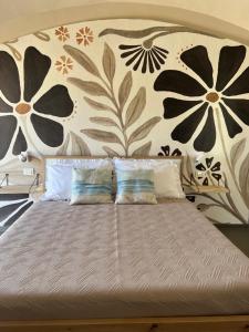 Letto o letti in una camera di Nausicaa Guesthouse