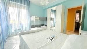 Postel nebo postele na pokoji v ubytování M446 - Marcelli, trilocale in residence con piscina