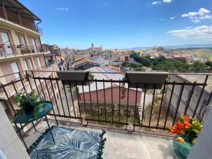 a balcony with a view of a city at Casa OXENA in Militello in Val di Catania