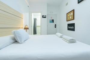 Ένα ή περισσότερα κρεβάτια σε δωμάτιο στο Easy Sants by Bossh! Hotels
