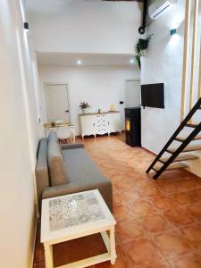 a living room with a couch and a table at Casa Ariadna in Bocairent +35 photos