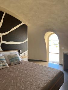 Letto o letti in una camera di Nausicaa Guesthouse
