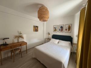 a bedroom with a bed and a table and a desk at El Patio Grande in Menasalbas +56 photos