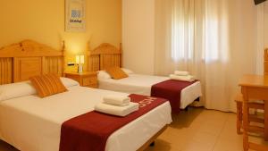 Posteľ alebo postele v izbe v ubytovaní Hostal Valdepeñas by Bossh! Hotels