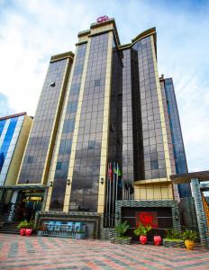 a tall building with a lot of windows at GR Comfort Hotel in Mbeya