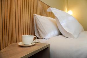 Postel nebo postele na pokoji v ubytování Hotel Serena Suite