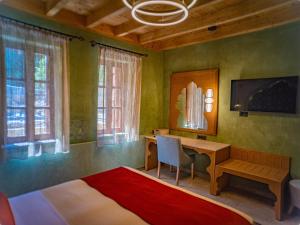 a bedroom with a desk and a bed and a table at Fabrizio del Carretto in Rhodes Town +44 photos