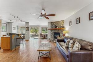 a living room with a couch and a fireplace at The Rikz Cabin in South Lake Tahoe
