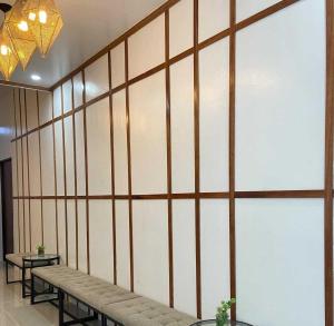 a large wall with benches in a room at OYO 1155 Carnivale Inn in Manila