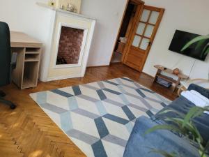a living room with a couch and a fireplace at La Mare Apartments - 25 in Constanţa