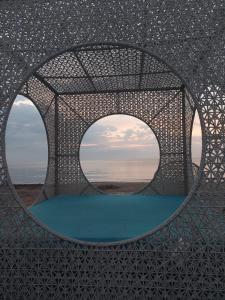 a circular metal structure with a view of the ocean at La Mare Apartments - 25 in Constanţa