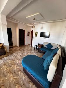 a living room with a bed and a couch at Azla Beach apartment 3 in Azla