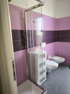 a bathroom with a shower and a sink and a toilet at Casa Cleo in Tortoreto Lido +11 photos