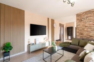 TV a/nebo společenská místnost v ubytování Villa mit eingezäuntem Garten und Panoramablick