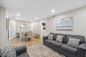 a living room with a couch and a dining room at Ocean Breeze - Island Retreat for 6 in Hilton Head Island
