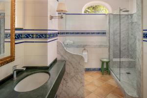 a bathroom with a sink and a shower at Hotel Caesar Augustus in Anacapri