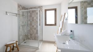 a white bathroom with a shower and a sink at Hotel Rosamar - Emar Hotels in Es Pujols