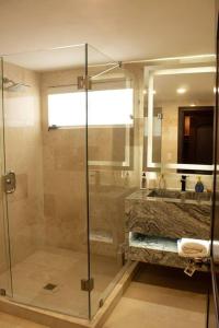 a bathroom with a shower and a sink at Villa Casa Blanca in Las Palmas