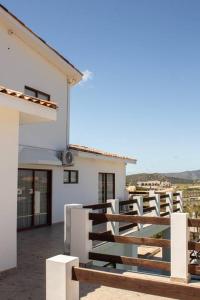 a balcony of a white building with a fence at Villa Casa Blanca in Las Palmas