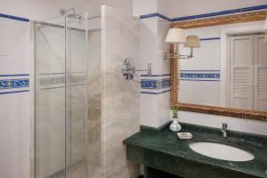 a bathroom with a sink and a shower at Hotel Caesar Augustus in Anacapri