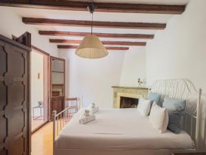 Ένα ή περισσότερα κρεβάτια σε δωμάτιο στο Majordoms - Castell de Villavecchia - 33 pax