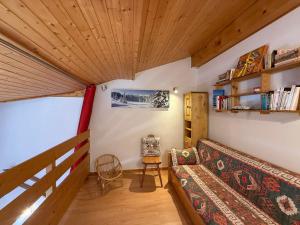 a living room with a couch and a wooden ceiling at Les Saisies Appartement 3 Pièces 8 Pers. avec 2 SDB et Garage - FR-1-293-275 in Hauteluce