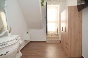a bathroom with a white sink and a mirror at A L Tourist House - La Corte Bianca - La Torre Blu in Carovigno +49 photos