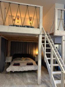 Ένα ή περισσότερα κρεβάτια σε δωμάτιο στο Loft Apartments and Event Venue in Central Warsaw