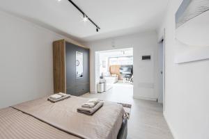 Ένα ή περισσότερα κρεβάτια σε δωμάτιο στο Green Luxe Suite 2